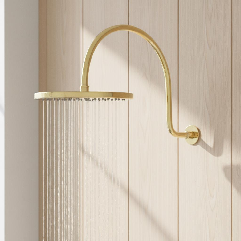 Unlacquered solid brass gooseneck shower arm with round rainfall showerhead for a luxurious bathroom finish