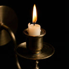 Handmade brass candle holder wall light creating warm ambient lighting for modern home decor