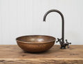 Handmade Hammered Copper Vessel Sink with Aged Bronze Faucet for Rustic Luxury Bathroom Designs