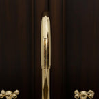 Close-up of a gold pen on a dark background