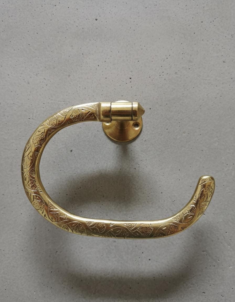 Gold decorative handle on a gray background
