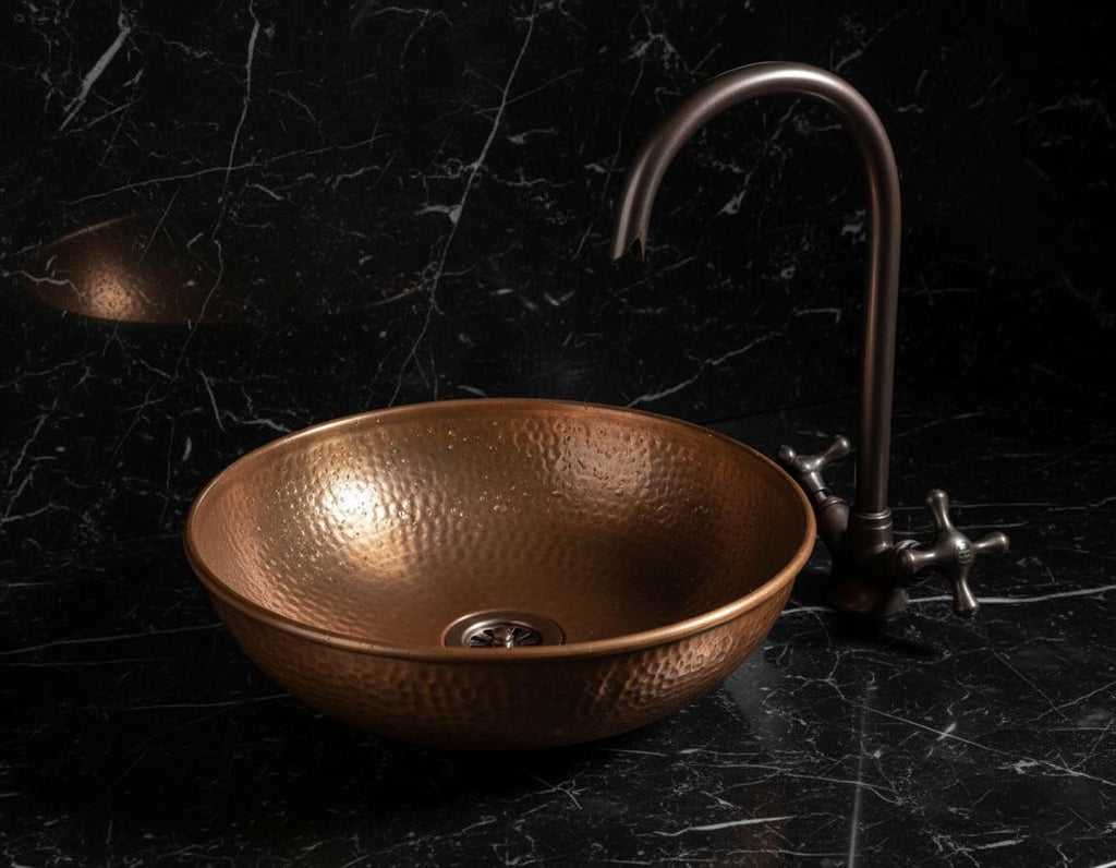 Handmade Hammered Copper Vessel Sink with Aged Bronze Faucet for Rustic Luxury Bathroom Designs