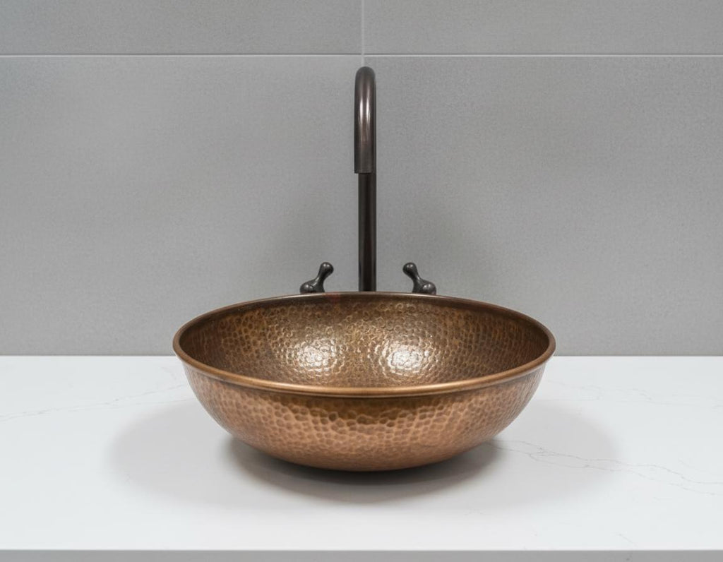 Handmade Hammered Copper Vessel Sink with Aged Bronze Faucet for Rustic Luxury Bathroom Designs